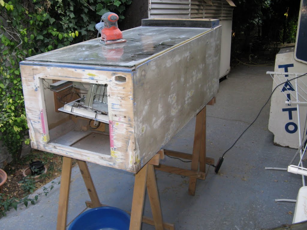 Sanding the cabinet of a vintage Gottlieb pinball