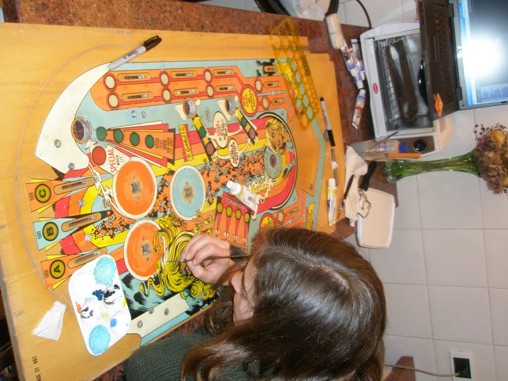 Detailed playfield art retouching by hand.